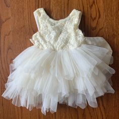 Reposhed! Ordered For My Daughter For A Wedding But She Wasn’t Able To Attend. Never Worn By Us! Cute Cream Princess Dress For Dress-up, Spring Cream Tulle Baptism Dress, Cream Sleeveless Princess Tutu Dress, Cream Ruffled Baptism Dress For Dress-up, Princess Style Cream Tutu Dress For Spring, Spring Princess Cream Tutu Dress, Cute White Princess Dress For Wedding, Cream Princess Style Sleeveless Baptism Dress, Sleeveless Ruffled Tutu Dress For First Communion