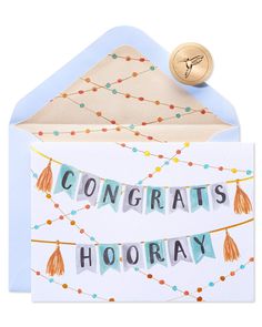 congratulations hooray card with tassels hanging from it's front and envelope