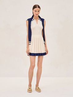 The Moritz Dress is a playful yet polished choice, perfect for when you want to look put together with a sporty twist. Its rich ivory color is striking, and the crisp marine blue trim adds a fresh contrast. The collar and button details lend a nod to classic tennis attire, while the flared skirt keeps it fun and flirty. This dress is great for a weekend outing or a casual get-together. Tennis Attire, Marine Blue Color, Tennis Photography, Look Put Together, Tennis Outfit, Summer 22, Sporty Casual, Golf Tournament, Blue Trim