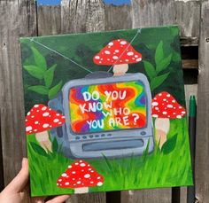 a painting of a tv with mushrooms on it and the words do you know who you are?