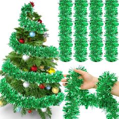 green christmas tree decorations with hand pointing at it