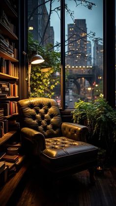 a leather chair sitting in front of a window next to a book shelf filled with books