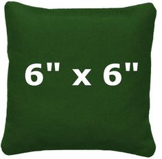 a green pillow with the number six on it's front and 6 in the back