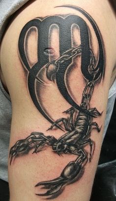 a woman with a scorpion tattoo on her arm