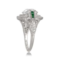 A beautiful Estate Emerald Cut Diamond Engagement Ring, accented by a tapered baguette and bullet-cut diamonds on either side. Luxury Three-stone Emerald Ring For Anniversary, Luxury Three Stone Emerald Ring For Anniversary, Silver Emerald Ring With Diamond Accents, Art Deco Emerald Cut Emerald Promise Ring, Art Deco Emerald Cut Emerald Ring For Promise, Elegant Three-stone Emerald Diamond Ring, Platinum Emerald Ring With Diamond Accents In Diamond White, Elegant Three Stone Emerald Diamond Ring, Formal Bezel-set Baguette-cut Emerald Ring