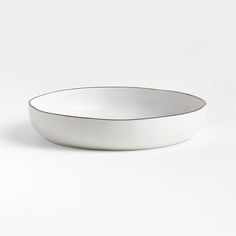 an empty white bowl on a white background