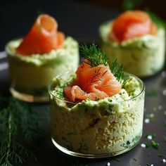 three small bowls filled with food and garnished with dill sprigs