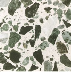 green and white marble textured with small rocks on it's sides, as well as the top part of an umbrella