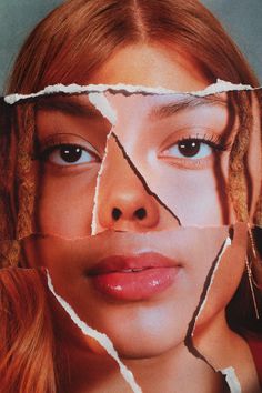 a woman's face with torn up pieces of paper in front of her eyes