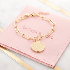 Treat yourself or someone special to our eternally best-selling Callie bracelet. Its chic chain link style is finished with an engravable disc pendant for the perfect everyday look. Available in 14k gold plated brass Pendant measures 5/8" 6" elongated link chain with 1" extender Lobster claw closure Made in the USA With engraving this item is FINAL SALE SKU: BYB1105 Custom Chain, Modern Jewellery Design, Disc Pendant, Personalized Monogram, Brass Pendant, Monogram Initials, Chain Link Bracelet, Modern Jewelry, Silver Bracelets