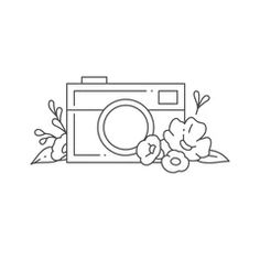 a camera and some flowers on a white background