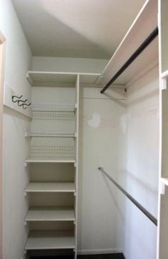 an empty walk - in closet with shelves and shelving