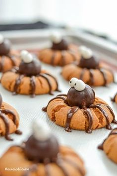 some cookies with chocolate icing and sprinkles on them