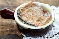 a dessert in a bowl on top of a doily