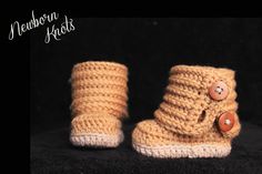 there is a pair of crocheted boots with buttons on the front and bottom