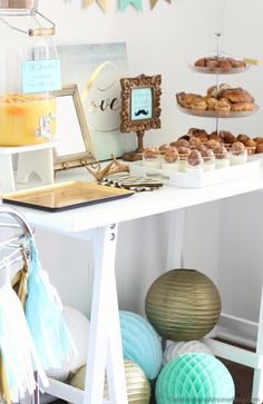 a table topped with donuts and pastries