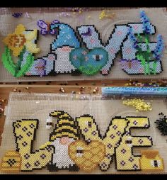 some type of bead art with the word love spelled in it