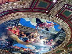 an ornate ceiling with paintings on it