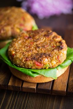 a close up of a burger on a wooden table