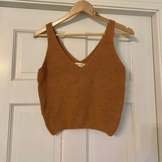 Cropped Sweater Tank. Medium. New With Tags. Camel Color And Very Soft! Casual Brown Cropped Tank Top, Casual Brown Knit Crop Top, Summer Brown Knit Crop Top, Casual Brown Crop Top For Fall, Trendy Brown V-neck Tank Top, Brown Knit Crop Top For Spring, Casual Brown V-neck Knit Top, Casual Brown Knit Top For Spring, Brown V-neck Crop Top For Fall