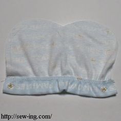 a baby's diaper is laying on top of a white surface