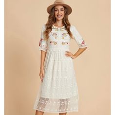 Size Medium Brand New Beautiful Multi-Colored Embroidery Lace Flower Detail Half Sleeves, Round Neck, Side Zipper Length: Midi Color: Ivory/Cream Spring Beige Midi Dress With Floral Embroidery, Beige Floral Embroidery Midi Dress For Spring, Beige Floral Embroidered Midi Dress For Spring, Beige Floral Embroidery Midi Dress For Garden Party, Spring Midi-length Embroidered Dress With Lace Trim, Spring Embroidered Midi Dress With Lace Trim, Feminine Beige Midi Dress With Floral Embroidery, Feminine Cream Midi Dress With Floral Embroidery, Cream Short Sleeve Dress With Floral Embroidery