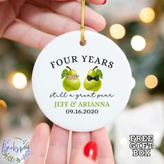 two green apples with bow tie on christmas ornament for four years tell a great man, jeff and arianna