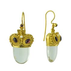 Inspired by roman designs, these dangle earrings feature a beautiful crystal, garnets and a pearl in a truly regal design. 24k gold over sterling silver. Size: 1 3/8" Rome Series, Ancient Roman Jewelry, Roman Jewelry, Replica Jewelry, Regal Design, Ancient Jewelry, Knot Earrings, Rhodolite Garnet, Moonstone Necklace