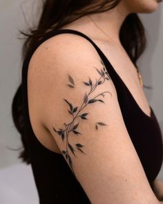 a woman with a tattoo on her arm