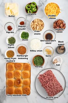 the ingredients to make an appetizer laid out on a white marble counter top