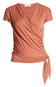 A faux-wrap front flatters on this soft and versatile jersey top cinched with a saucy tie at the hip. 23 1/2" length Surplice V-neck Short sleeves 95% rayon, 5% spandex Machine wash, dry flat Imported Women's Clothing Casual Trendy Outfits, Wrap Front Top, Faux Wrap Top, Pink Polish, Crop Top Blouse, Wrap Blouse, Jersey Top, Wrap Top, New Wardrobe