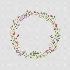 a cross stitch pattern with flowers in the center and leaves on each side, as well as an oval frame