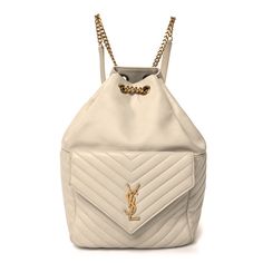 This is an authentic SAINT LAURENT Lambskin Matelasse Monogram Joe Backpack in Cream. This backpack is crafted of fine off white lambskin leather. The backpack features adjustable leather shoulder straps, aged gold hardware and a crossover flap with a gold YSL logo. The top opensto a spacious black fabric interior with zipper pocket. Ysl Backpack, Ysl Logo, Lambskin Leather, Black Fabric, Gold Hardware, Crossover, Shoulder Straps, Zipper Pocket, Saint Laurent