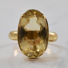 Metal | 10k Yellow Gold  ---|---  Size | 10  Width | Top: 20.50mm, Band: 3.70mm  Gemstone | Oval Cut Citrine  Carat | 11.80ct Formal Yellow Gold Faceted Gemstones, Classic Yellow Gold Faceted Rings, Classic Solitaire Gemstones For Formal Occasions, Classic Faceted Gemstones For Anniversary, Classic Formal Faceted Rings, Classic Yellow Faceted Rings, Classic Formal Rings With Faceted Details, Faceted Gemstones In 14k Gold For Formal Occasions, Classic Oval Faceted Topaz Ring