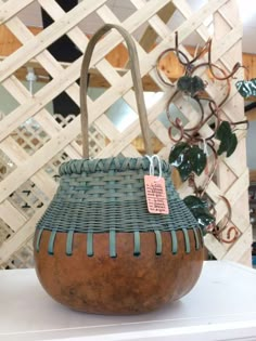 a basket sitting on top of a white table