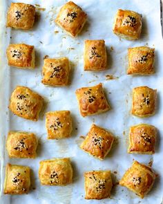 there are many small pieces of food on the baking sheet