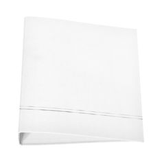 a white sheet that is laying on top of a table