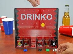 a drink dispenser sitting on top of a wooden table