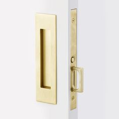 an open door with a handle on the front and side doors, both in satin brass