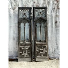 an old pair of wooden doors with intricate designs