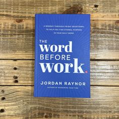 the word before work book sitting on top of a wooden table with wood planks