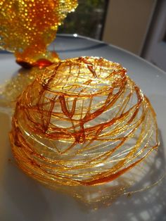 an orange object sitting on top of a white table