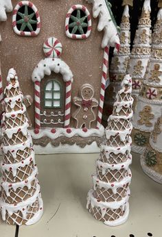 a gingerbread house decorated with candy canes and icing