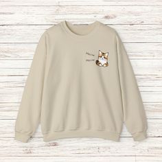 Introducing our ultra-cozy and irresistibly adorable Cat Sweatshirt! Designed with cat lovers in mind, this purr-fect piece of apparel is the ideal addition to any feline enthusiast's wardrobe.  Crafted with utmost care and attention to detail, this sweatshirt features a delightful and unique cat design that showcases your love for these charming creatures. The high-quality fabric provides both comfort and durability, ensuring it will remain a favorite for years to come.  Whether you're lounging at home, running errands, or going on a casual outing, our Cat Sweatshirt is here to keep you stylish and snug. Its relaxed and versatile fit makes it easy to pair with your favorite jeans, leggings, or even a cozy pair of joggers.  Not only will this sweatshirt serve as an expression of your passi Casual Crew Neck Sweatshirt With Cat Print, Winter Crew Neck Top With Cat Print, Cotton Crew Neck Sweater With Cat Design, Relaxed Fit Long Sleeve Sweatshirt With Cat Print, Cat Design Cotton Long Sleeve Sweatshirt, Casual Cotton Sweatshirt With Cat Design, Cotton Crew Neck Sweatshirt With Cat Design, Casual Cotton Sweatshirt With Cat Print, Long Sleeve Cotton T-shirt With Cat Design