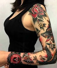 a woman with tattoos on her arms and arm