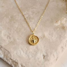 North Star Compass Pendent Necklace - Featuring a North Star Compass Necklace, dainty and perfect for layering - Length: 18" + 2" Extender - Base Material: High Quality Stainless Steel - Finish: 18K Gold - Nickel Free - All our jewelry is packaged in gift ready boxes. If you would like multiple items from your order packaged separately please let us know! © 2023 Generation of Daughters Star-shaped Compass Necklace As A Gift, Star-shaped Compass Necklace As Gift, Star-shaped Compass Design Necklace As Gift, Star-shaped Compass Design Necklace For Gift, Star-shaped Compass Necklace Gift, Star Charm Round Pendant Necklace For Jewelry Making, Necklace Layering Gold, Wishing Star, Gold Pendent