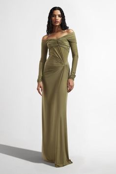 Sage green draped dress with off-shoulder sleeve detailing.
Components: 1
Type Of Work: Plain
Neckline: Straight
Sleeve Type: Full sleeves
Fabric: Malai Lycra
Color: Green
Other Details: 
Model height: 5 ft 10 inches, wearing size S
Pleated bodice
Occasion: Cocktail - Aza Fashions Off The Shoulder Long Sleeve Dress, Drape Gowns Indian, Guest Checklist, Draped Gown, Green Plain, Drape Gowns, Drape Maxi Dress, Off Shoulder Gown, Editing Ideas