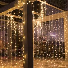 an outdoor gazebo covered in fairy lights