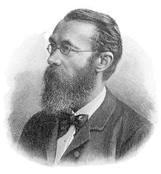 an old black and white photo of a man with a beard, wearing glasses and a bow tie