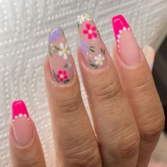 Embrace spring with these vibrant hot pink French tips adorned with delicate purple floral accents. Perfect for a fresh, seasonal look for your nude coffin nails 🌸Click on the image to shop our Spring Gel Nail Polish Collection. 🌸Credit: nails_by_cnd on Instagram🌸 Spring nail design, hot pink nails, French tips, floral nails, march nails, pink nails, coffin nails, nail trends 2024, colorful nails, simple nail ideas Pink And Floral Nails, Pink And Purple Floral Nails, Gel X Coffin Nails, Pink And Purple Summer Nails, Spring Acyrilics Nails, Flower Themed Nails, March Nails Ideas Spring, Spring Nails 2024 Trends Coffin, Pink Blue And Purple Nails